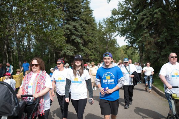 A brain tumour survivor, recognizable by his blue shirt, walks to end brain tumours in Edmonton, Alberta in May 2016 A brain tumour survivor, recognizable by his blue shirt, walks to end brain tumours in Edmonton, Alberta in May 2016